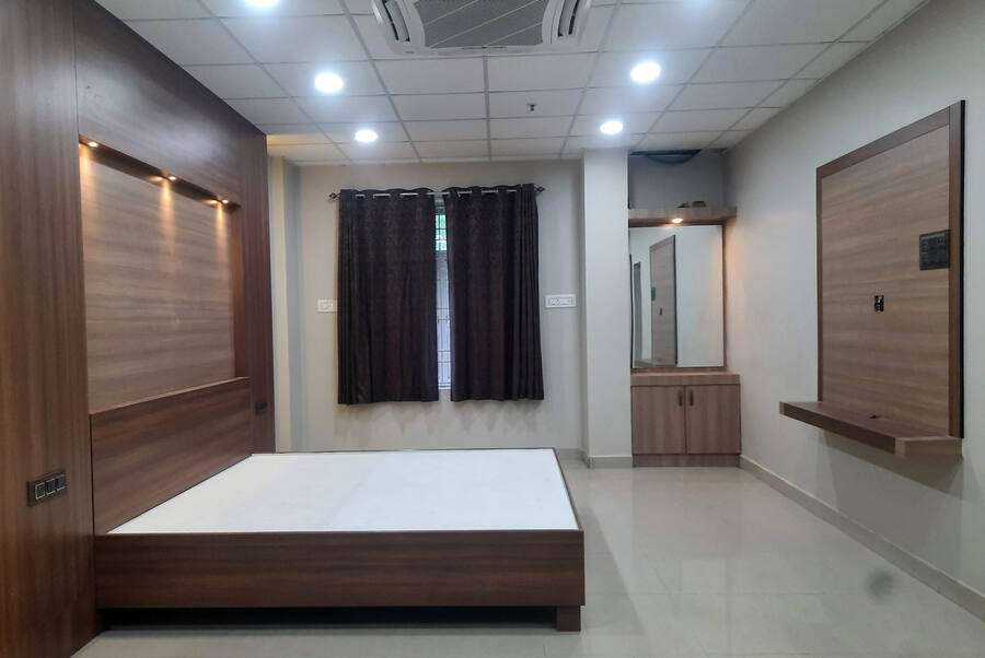 Bedroom with wardrobe run and headboard panelling