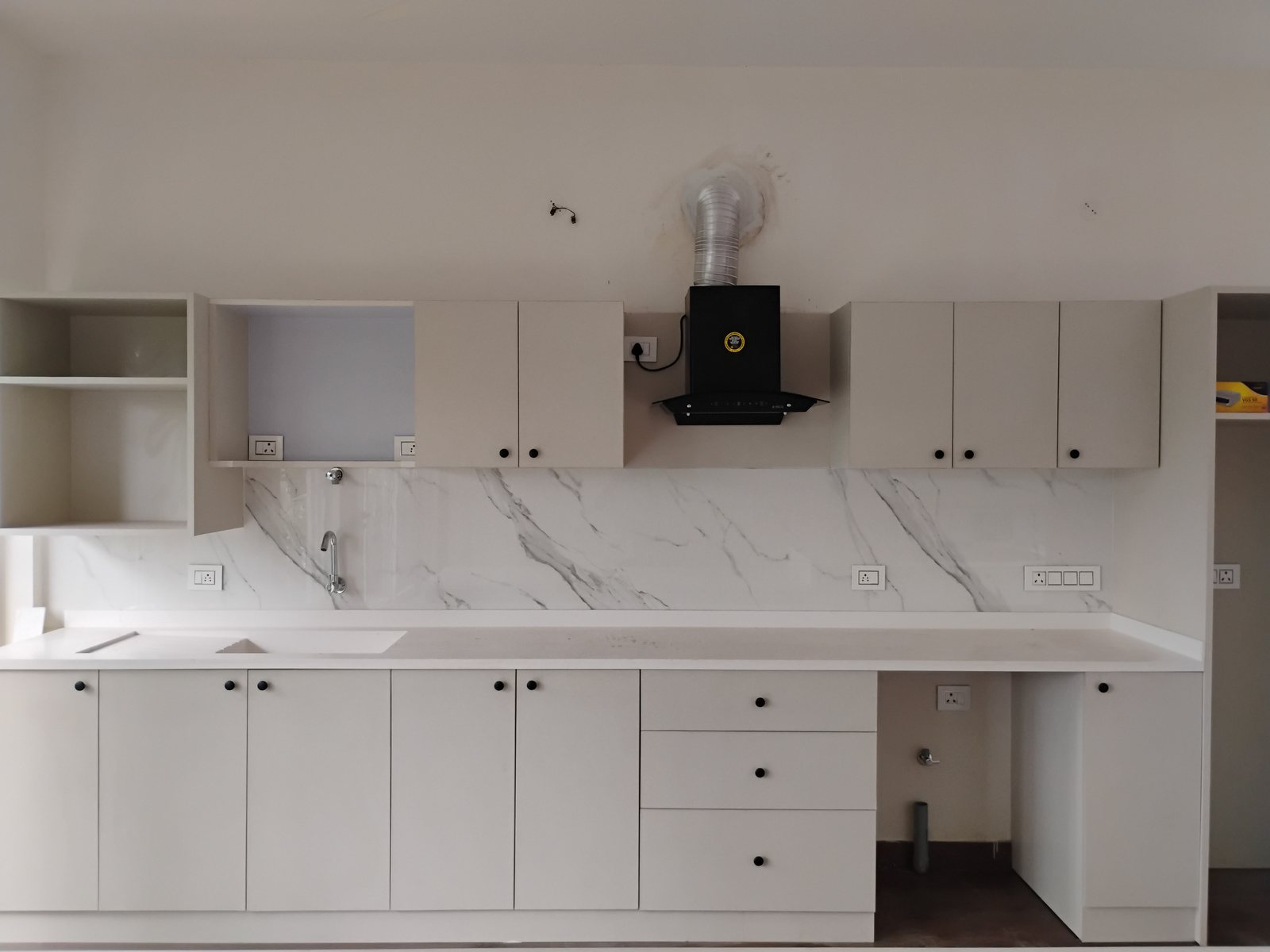 White kitchen with marble dado