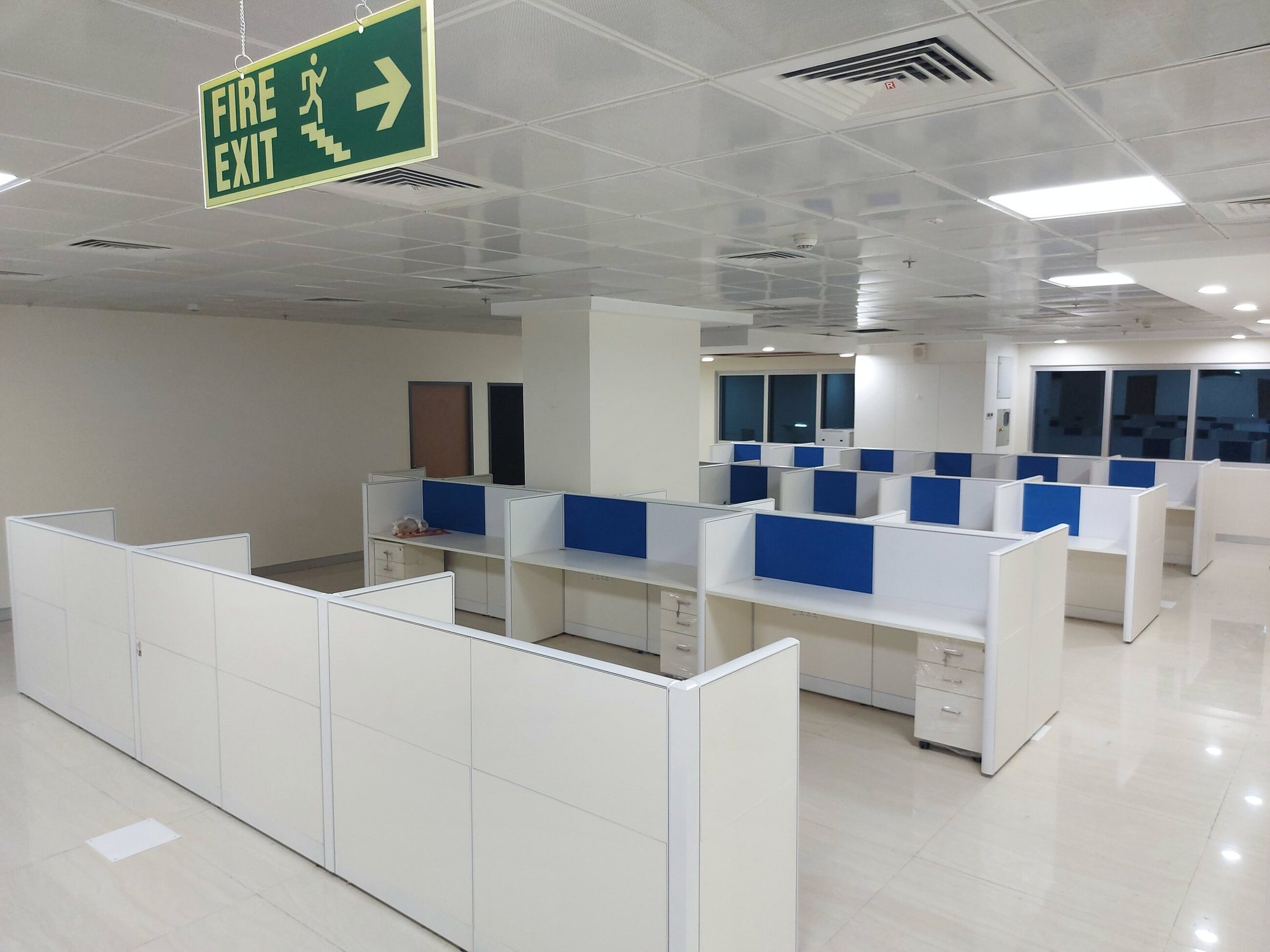 Office floor fitted out with modular workstations and screens