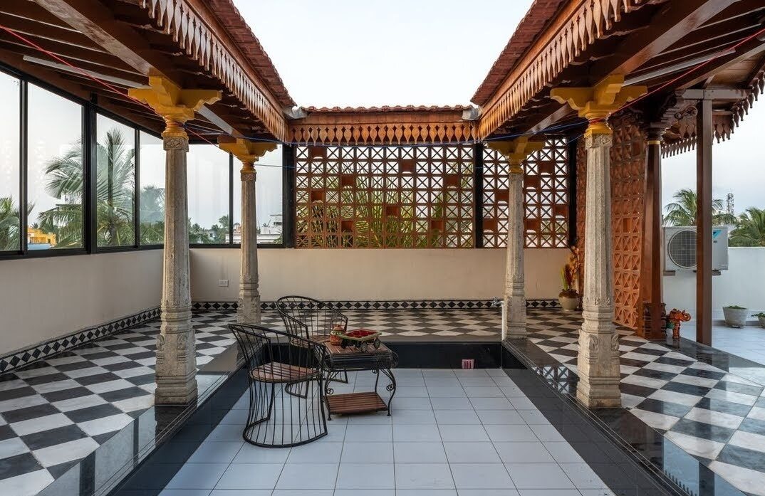 Traditional courtyard with carved columns and jaali screens