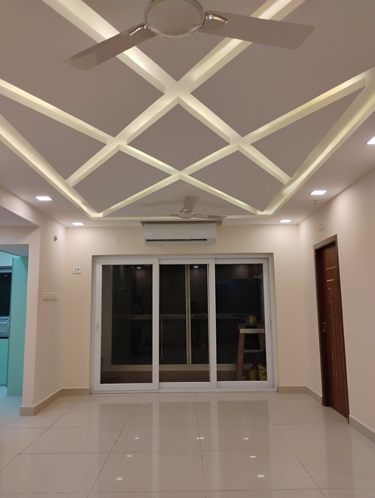 Criss-cross false ceiling with cove lighting