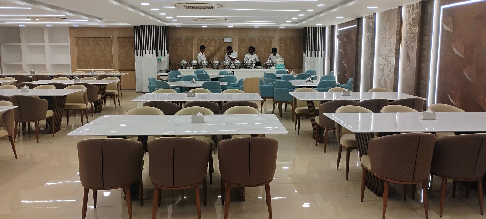 Banquet hall with seating, ceiling and feature lighting