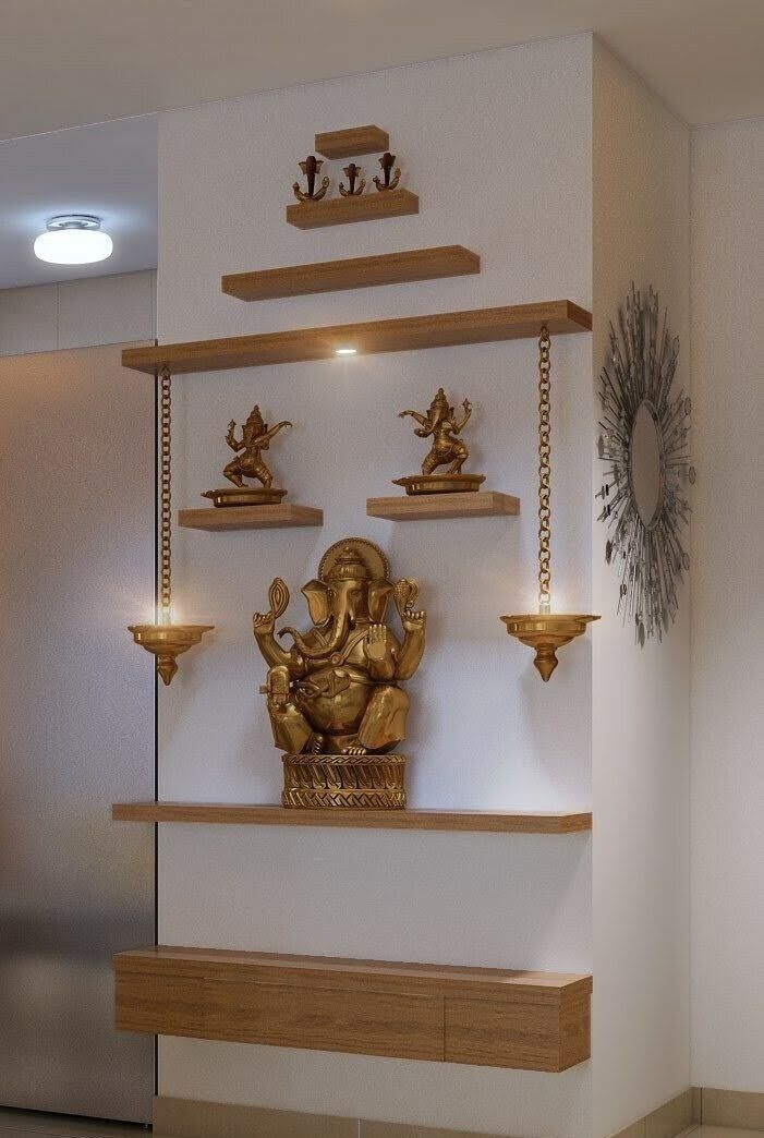 Wall-mounted mandir with floating shelves and backlit niche