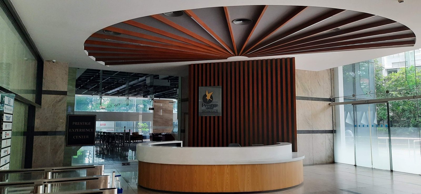 Corporate reception with radial ceiling and curved desk